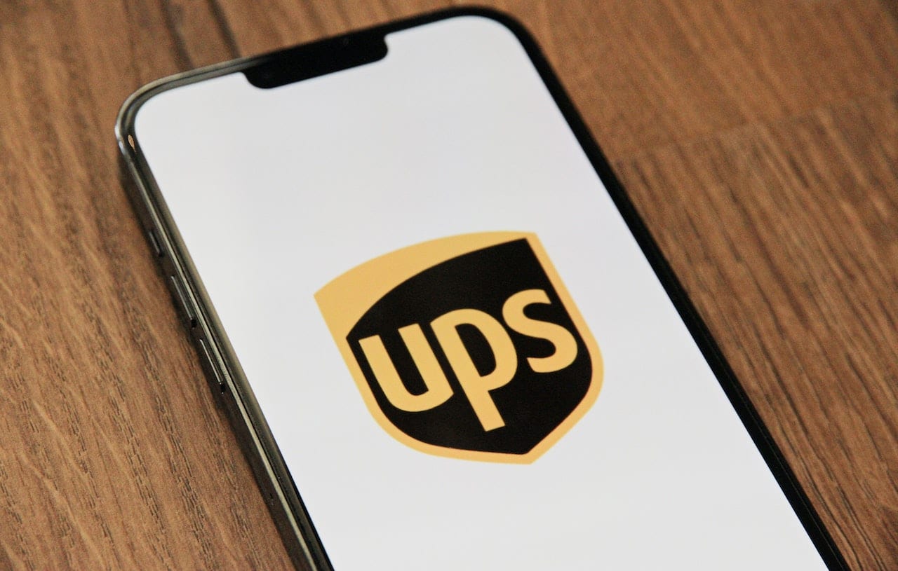 Image of a UPS logo, highlighting the world's largest package delivery company and the risks associated with truck accidents.