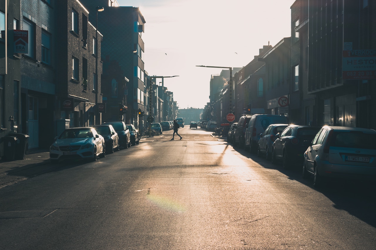 A pedestrian walks down a street, highlighting the importance of safety under the new jaywalking law.