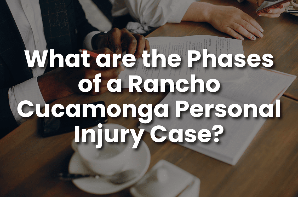 Attorney and client reviewing documents at a table, with text overlay about the phases of a Rancho Cucamonga personal injury case