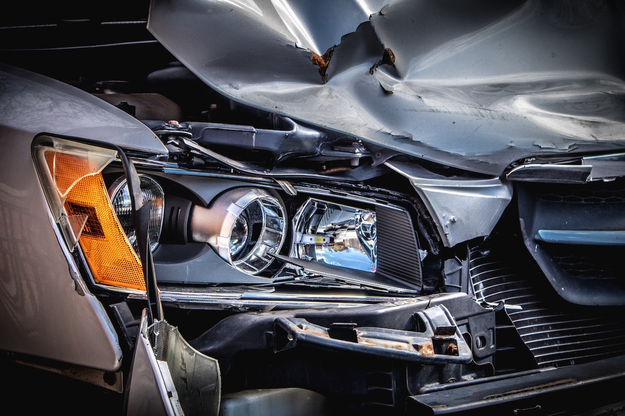 A damaged car with a severely impacted front end, illustrating potential personal injury claim scenarios in Rancho Cucamonga.