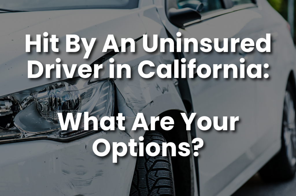 Damaged white car after an accident with the text “Hit By An Uninsured Driver in California: What Are Your Options?” for uninsured driver accident claims in California.